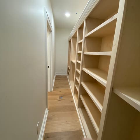 A run of new built-in shelving seen from the doorway